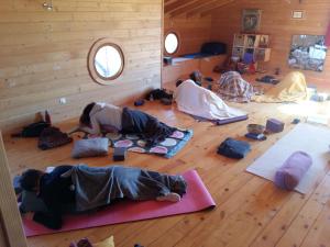 a group of people laying on the floor doing yoga at Ecolodge Bellevue ALBI in Albi