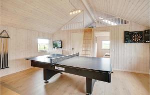 a ping pong table in the middle of a room at Awesome Home In Odder With Kitchen in Odder