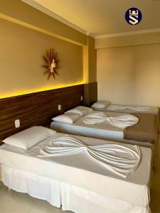 Ένα ή περισσότερα κρεβάτια σε δωμάτιο στο Soberano Plaza Hotel