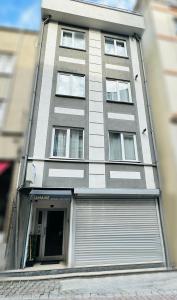 a tall building with a garage door in front of it at 6 Hane Üsküdar Serviced Apartments in Istanbul