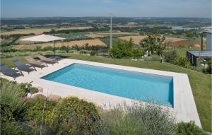 a swimming pool on top of a hill with chairs at Lovely Home In Alviano With Kitchen in Alviano