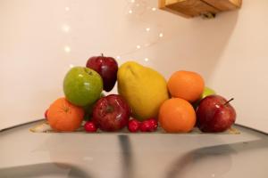 a plate of fruit on top of a table at BrideHousehaifa in Haifa