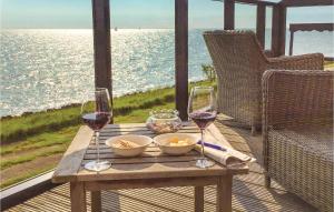 a wooden table with two glasses of wine on a deck at Wachter in Stavoren +19 photos