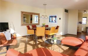 a living room with a table and chairs at Wachter in Stavoren