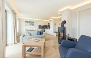 a living room with a couch and a table at Penthouse Cloud in Binz