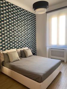 En eller flere senger på et rom på Trastevere Design Apartment