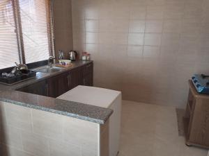 a kitchen with a counter top and a sink at شقة فندقيه مفروشه in Jerash