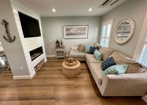 a living room with a couch and a fireplace at 7 Young St - Newport in Newport