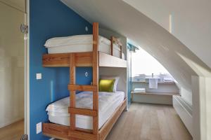 Postel nebo postele na pokoji v ubytování Kustappartementen