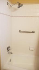 a bathroom with a bath tub with a sink at The perfect place . . . here it is! in Las Cruces