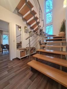 a staircase in a home with wooden floors at Ferienwohnung Sonneberg in Sonneberg