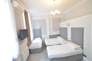 Кровать или кровати в номере Amber Residence Aparthotel