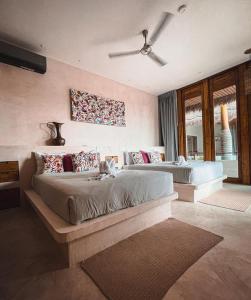 Postel nebo postele na pokoji v ubytování Hotel Casa Margot