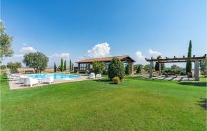 a large yard with a pool and a house at Formiconcino in Montebello