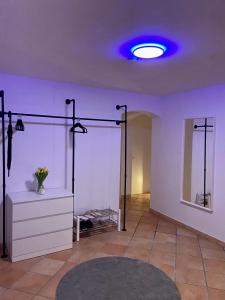 a room with a dressing room with a blue light at Traumhafte 115 qm Ferienwohnung am Steinhuder Meer, Ruhig, Komfortabel, Loggia, Parkplatz, WiFi in Wunstorf +34 photos
