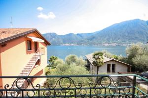 a view of the water from a balcony of a house at Casa Luisella By LoveComo in Sala Comacina