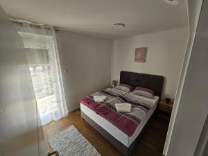 Katil atau katil-katil dalam bilik di Appartment Podravina