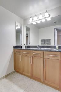 a kitchen with a sink and a large mirror at Spacious 2 BR Apartment At Pentagon City in Arlington