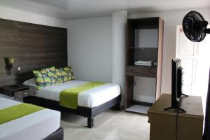 En eller flere senger på et rom på Finca Hotel San Angello