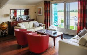 a living room with a couch and chairs and a table at 3 Bedroom Beautiful Home In Workum in Workum