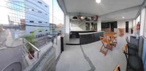 a balcony of a building with a bar and a restaurant at Hotel Cabana in Parauapebas