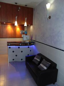 a living room with a couch and a table at Hotel Libertador in Cullera