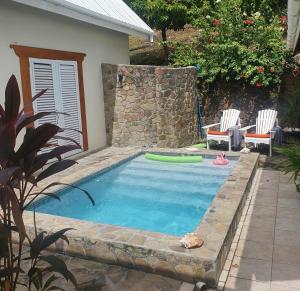 The swimming pool at or close to Harbour View House Villa