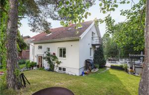 a white house with a yard at Stunning Home In Gteborg With Sauna in Gothenburg