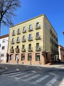 a large building on the corner of a street at Apartment Adam & Eva in Piešťany