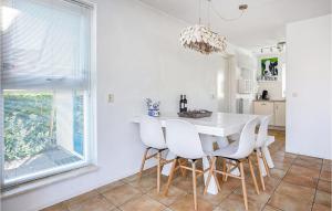 a white dining room with a white table and chairs at Amazing Home In Workum With Wifi in Workum