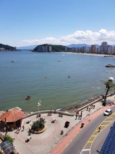 a view of a large body of water with buildings at NAUTILUS SEAVIEW BAY-SV/SP in São Vicente