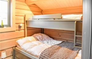 a small room with a bunk bed in a cabin at Beautiful Home In yer With Sauna, 5 Bedrooms And Wifi in Øyer