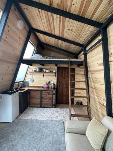 a room with a bunk bed and a kitchen at 5- Modern tasarım ahşap ev in Çatalca