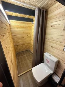 a small bathroom with a toilet in a sauna at 5- Modern tasarım ahşap ev in Çatalca