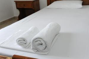 A bed or beds in a room at Morfeas Hotel