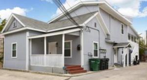 a white house with a white porch at Hess St in San Antonio