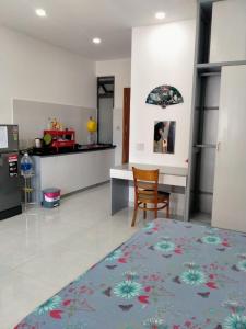 a living room with a bed and a kitchen at A&H apartment, new, close to beach and market, in quite peaceful street in Nha Trang