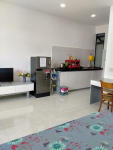 a living room with a kitchen with a counter at A&H apartment, new, close to beach and market, in quite peaceful street in Nha Trang