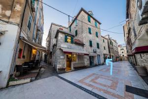 an empty street in an alley with buildings at Bozena's studio apartment in Split