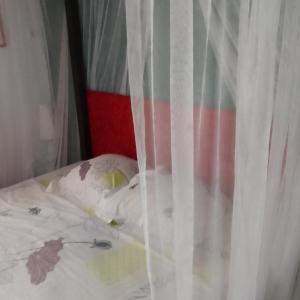 Postel nebo postele na pokoji v ubytování KAZA CHARLY F2