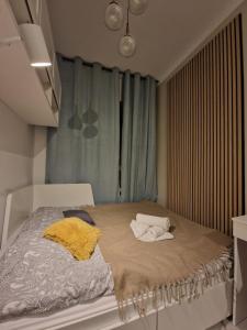 Łóżko lub łóżka w pokoju w obiekcie City Center Studio Apartments