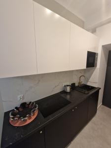 Kuchnia lub aneks kuchenny w obiekcie City Center Studio Apartments