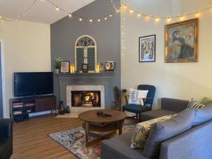 a living room with a couch and a fireplace at Music Escape in Nashville