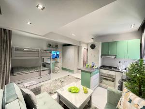 a kitchen and living room with a bunk bed at Luxury Studio House 589-3 in 6th Of October