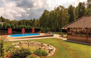 a backyard with a swimming pool and a pavilion at 3 Bedroom Beautiful Home In Brestovac in Novo Zvecevo