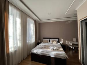 Katil atau katil-katil dalam bilik di Serenity Likani Villa Hotel