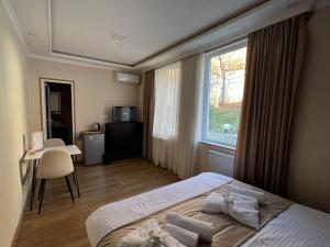 Katil atau katil-katil dalam bilik di Serenity Likani Villa Hotel