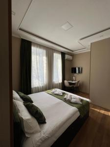 Katil atau katil-katil dalam bilik di Serenity Likani Villa Hotel
