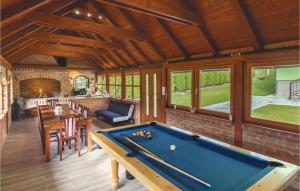 a room with a pool table in a house at Lovely Home In Brestovac With Outdoor Swimming Pool in Novo Zvecevo