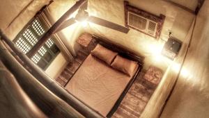 an overhead view of a room with a bed at Capiz Beach Villa family room for 6 pax in Calatagan +31 photos